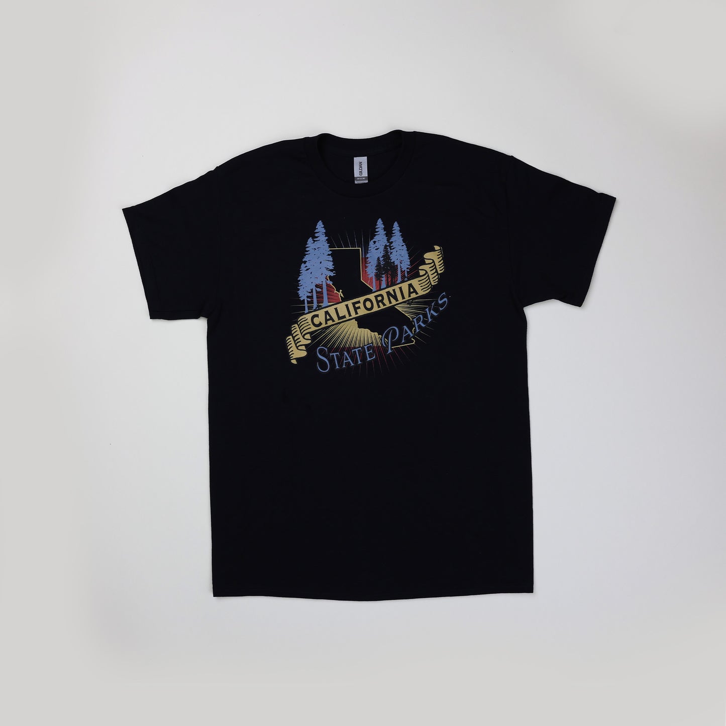 a black t-shirt featuring a silhouette of the state, in front of yellow rays, surrounded by blue silhouettes of redwood trees and the words California State Parks