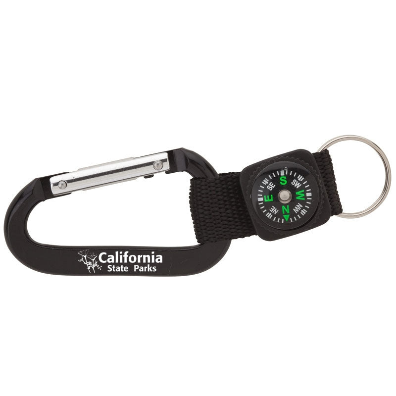 a small compass attached to a black carabiner