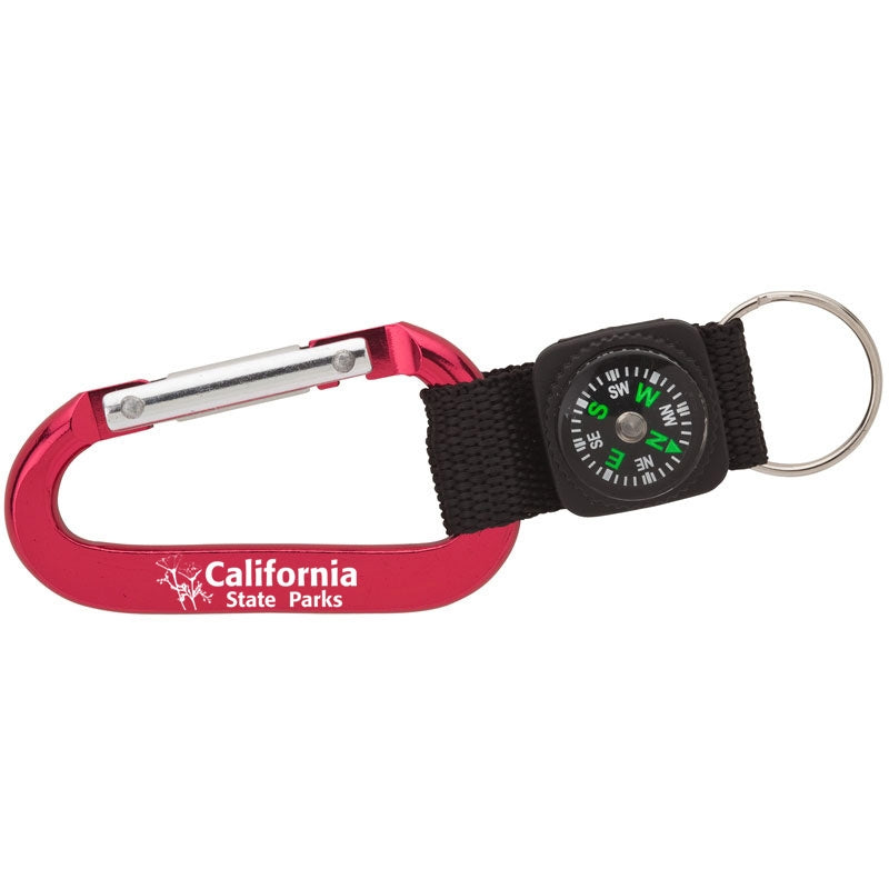 a small compass attached to a red carabiner