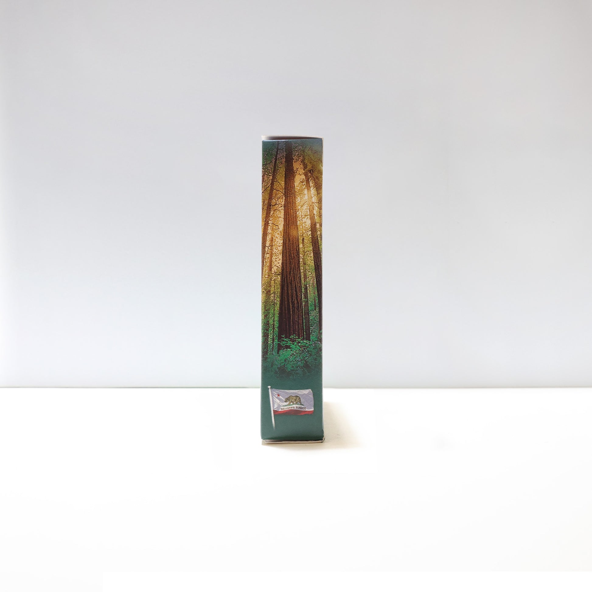 the side of the pack of cards, with the California flag and some Redwood trees