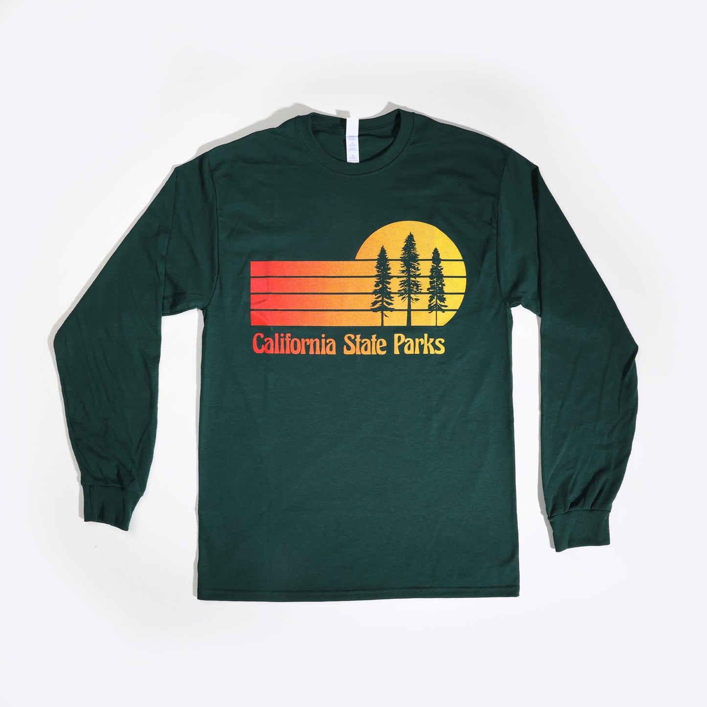 a long sleeve, forest green t-shirt featuring a retro sunset design with three Redwood trees