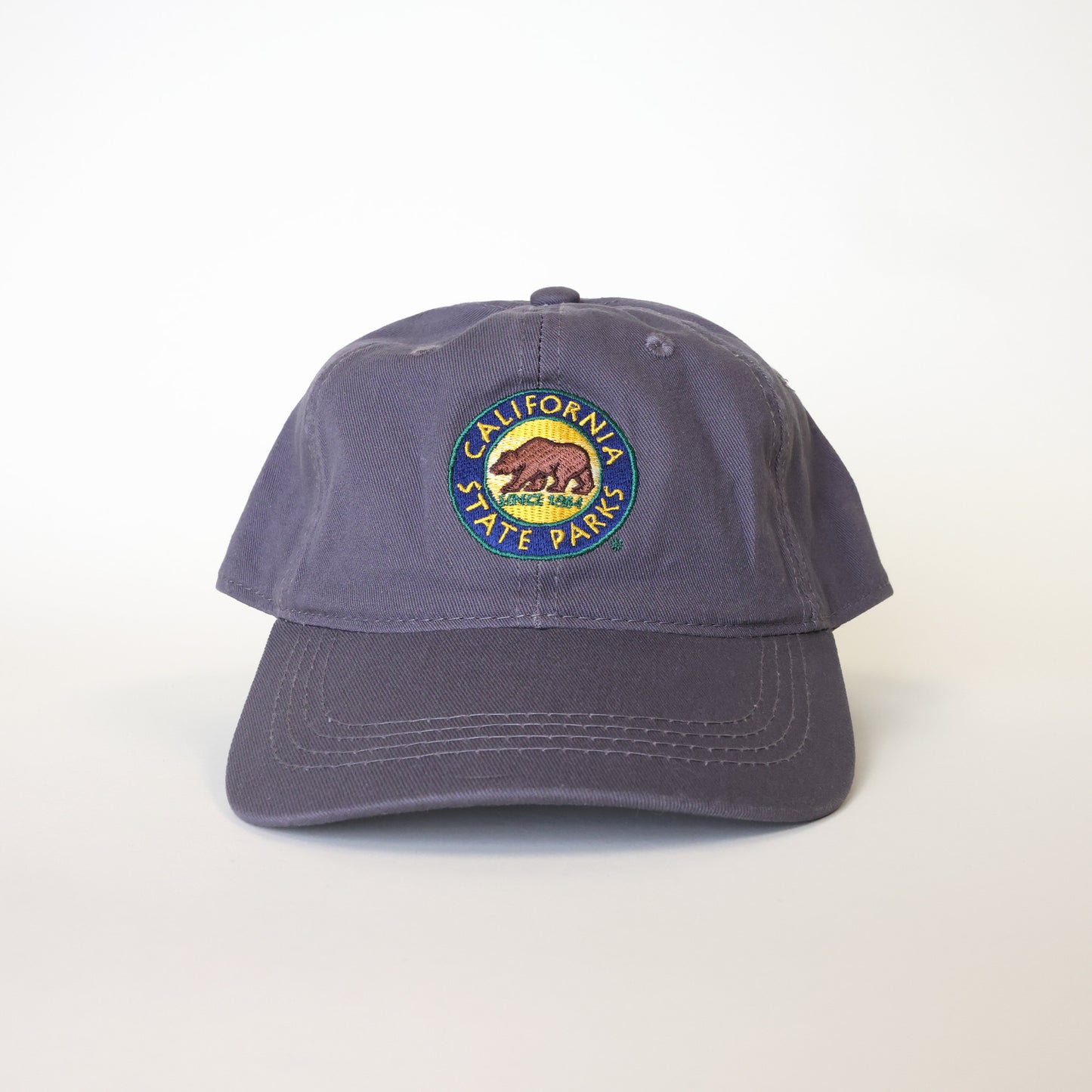 a blue baseball hat with an embroidered California State Parks logo