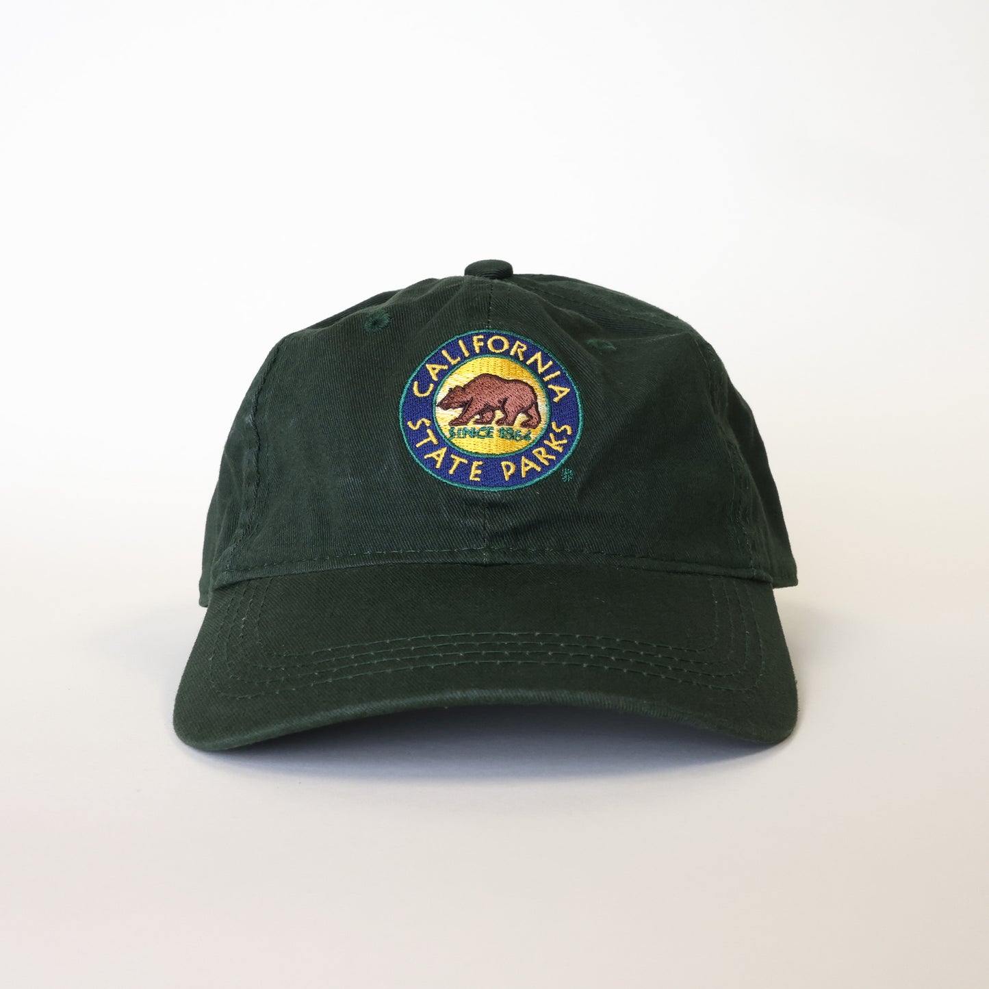 a forest green baseball hat with an embroidered California State Parks logo