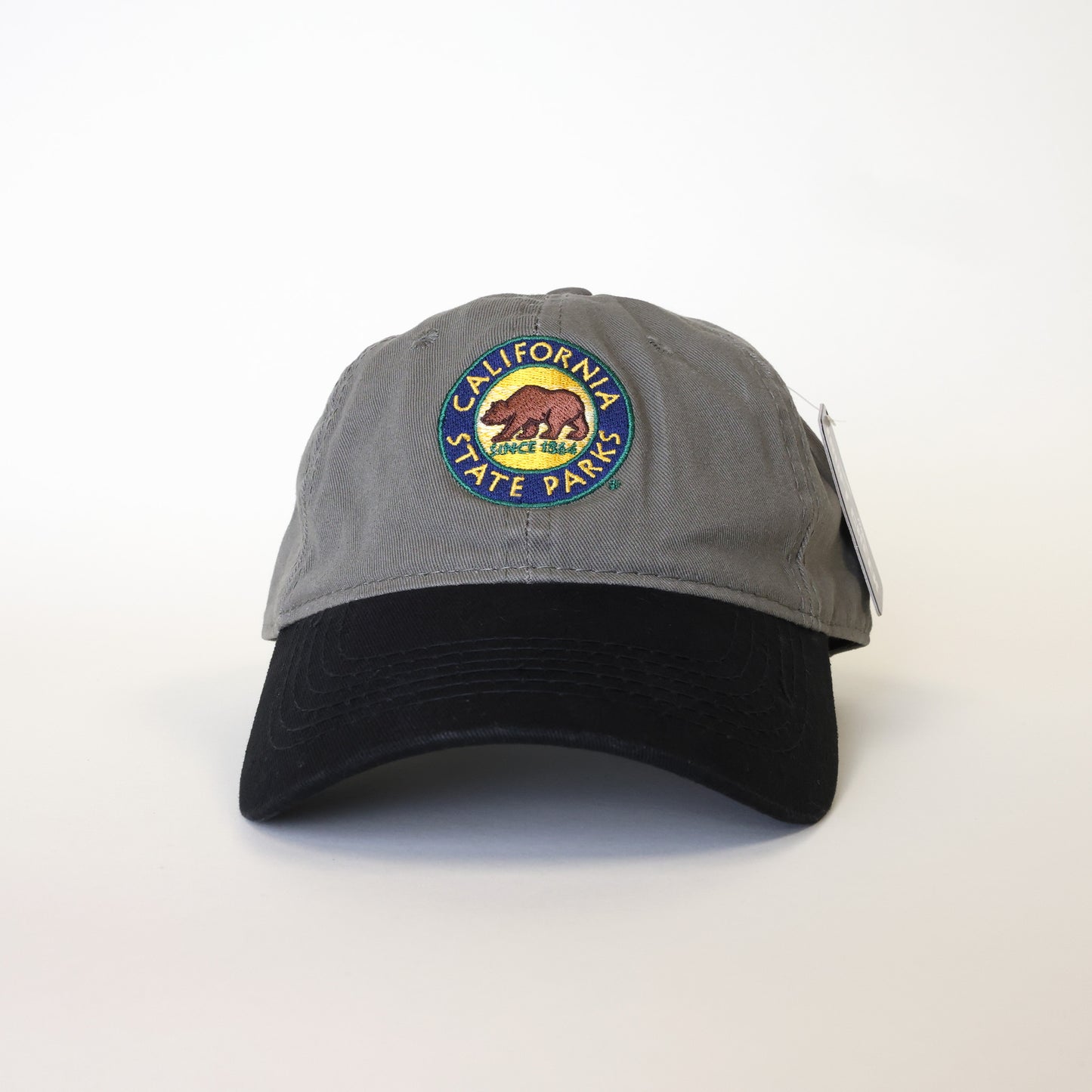 a baseball hat with a grey cap and a black colored bill, and an embroidered California State Parks logo
