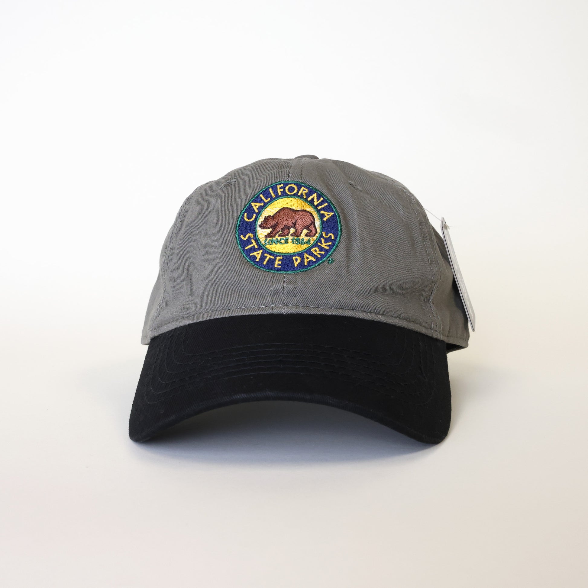 a baseball hat with a grey cap and a black colored bill, and an embroidered California State Parks logo