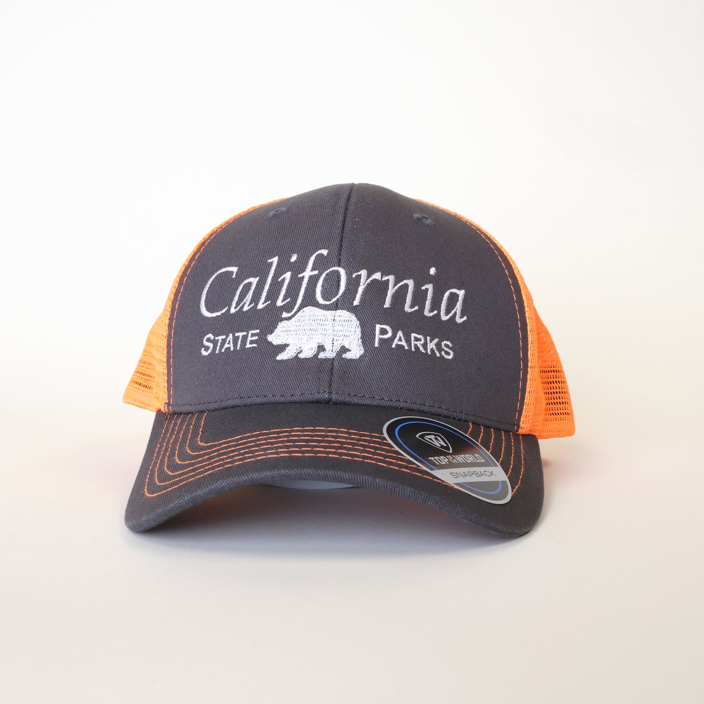 a grey trucker hat with bright orange mesh and the words California State Parks