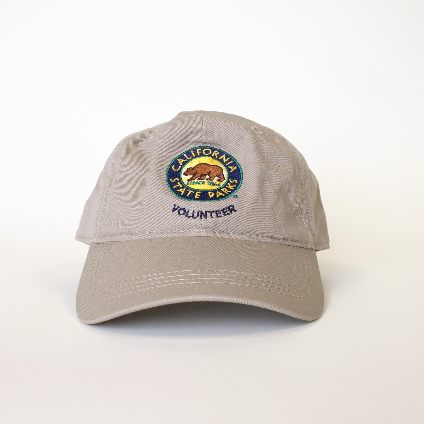 a tan colored baseball hat that says Volunteer and has the California State Parks logo