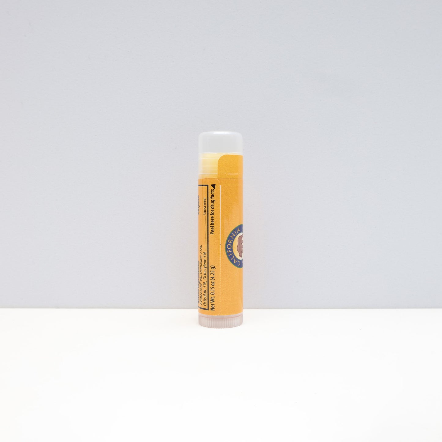 a side view of the yellow tube of lip balm