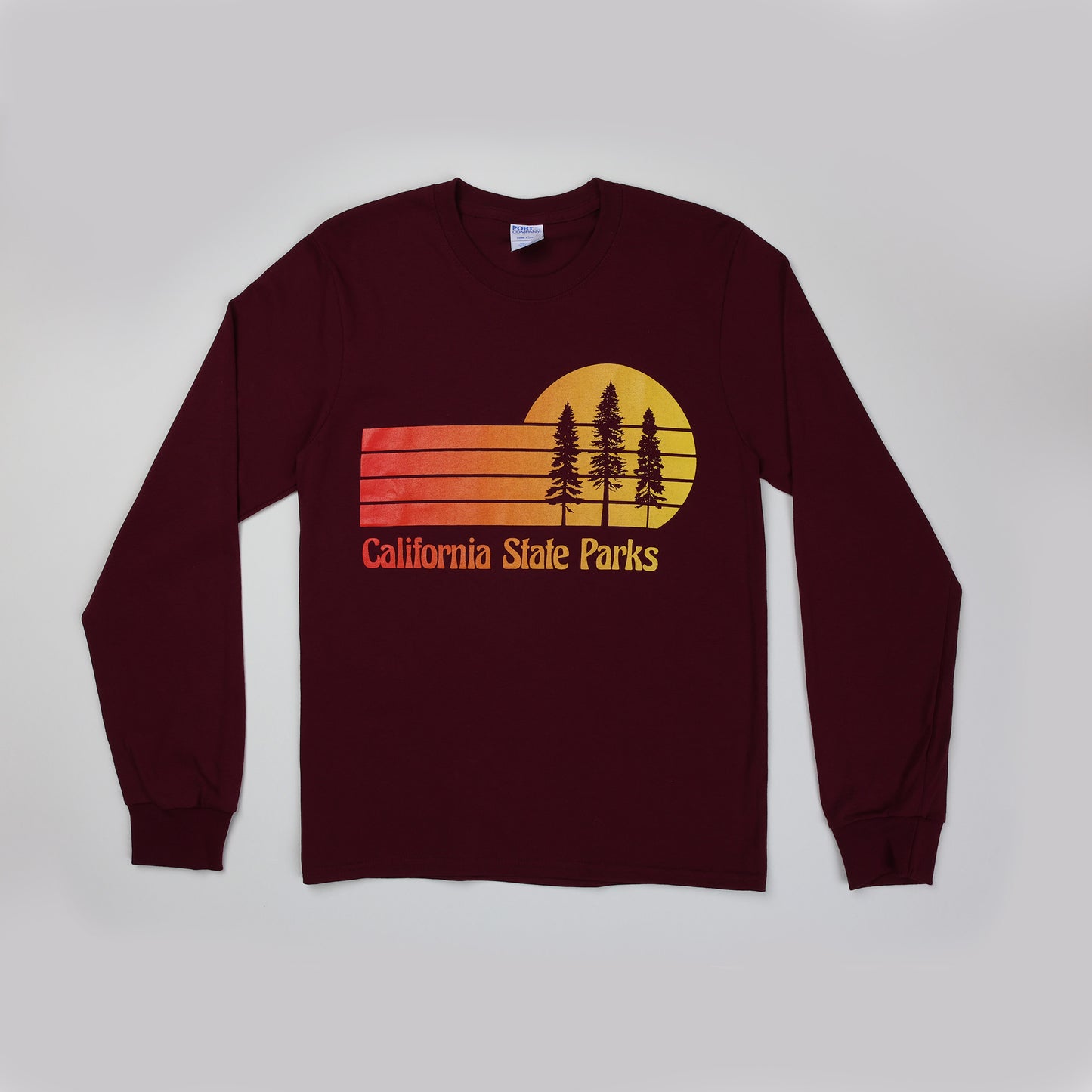 a long sleeve, maroon t-shirt featuring a retro sunset design with three Redwood trees