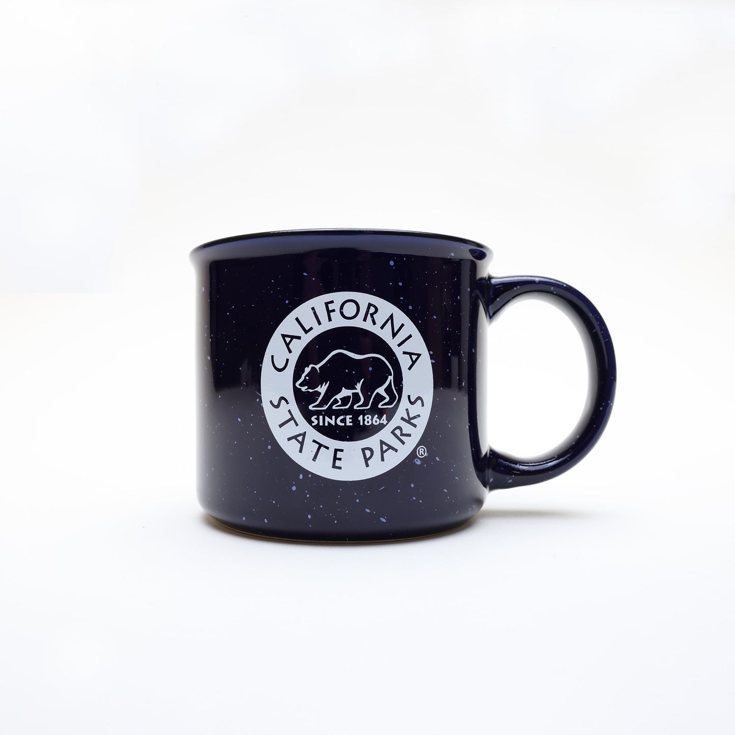 a navy blue campfire style mug with white speckles and a California State Parks logo
