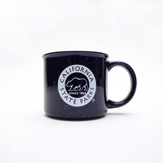 a navy blue campfire style mug with white speckles and a California State Parks logo