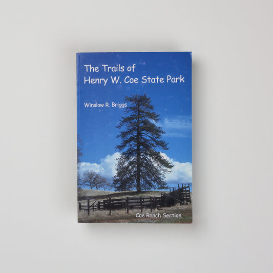 the cover of The Trails of Henry W Coe State Park, featuring a very blue sky, a wooden fence, and a tall tree